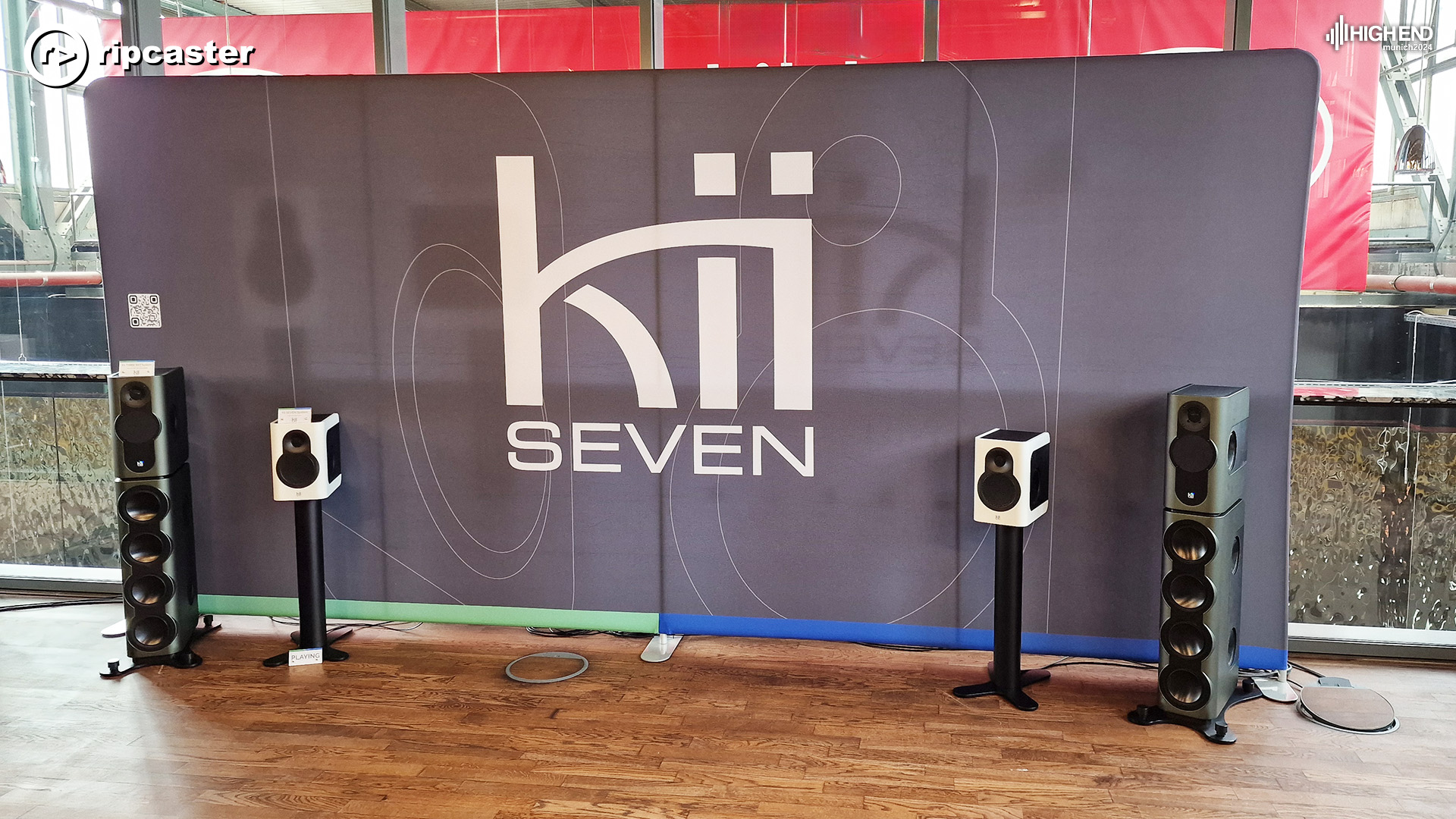 Two pairs of Kii speakers either side of the Kii backdrop.