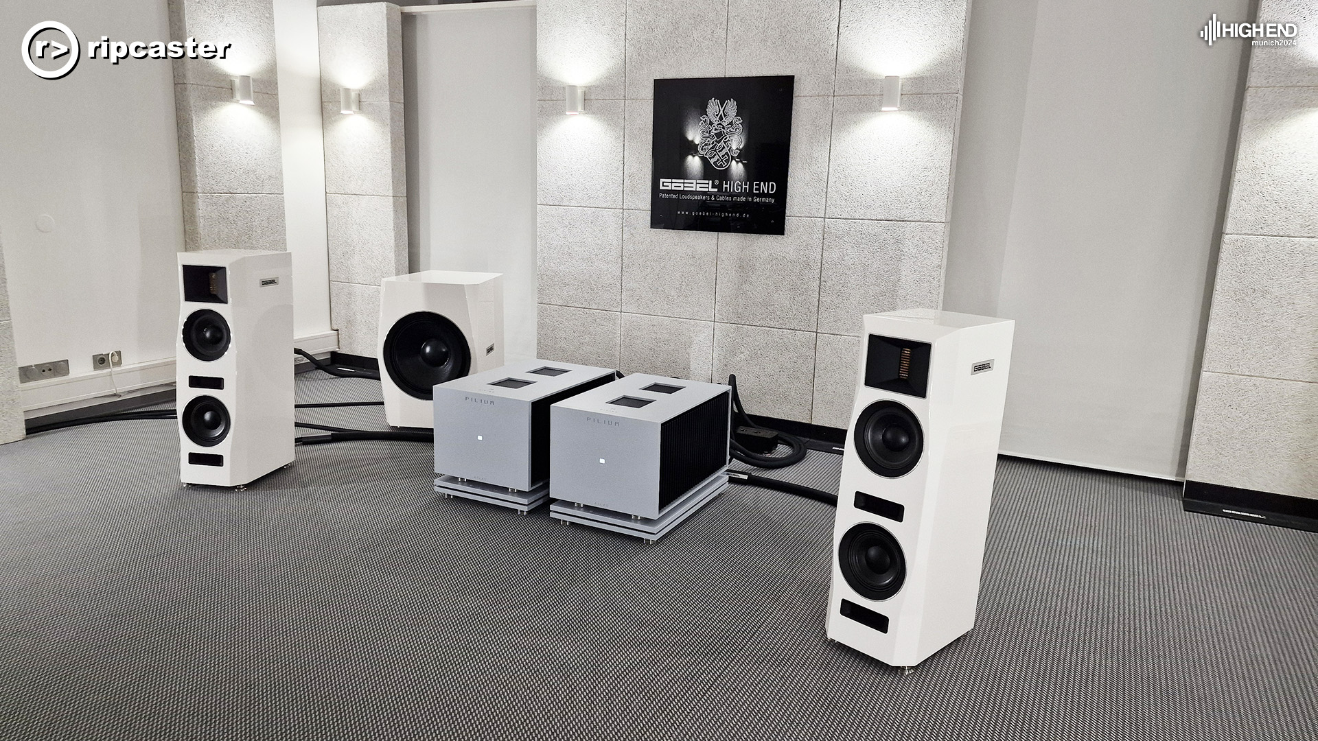 All white and grey.  A pair of floorstanding speakers either side of some grey and black HiFi units.