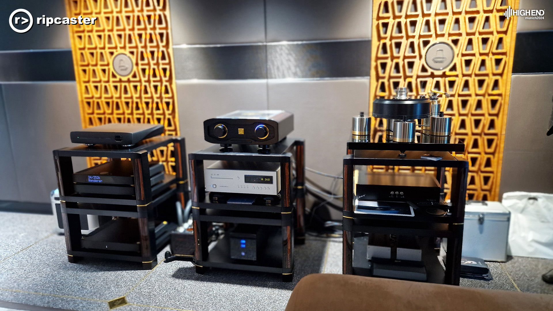 Various pieces of HiFi equipment with acoustic panels behind.
