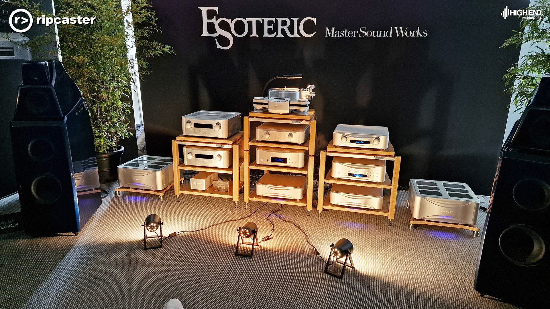 Esoteric.  Black floorstanding speakers with other HiFi equipment on stands