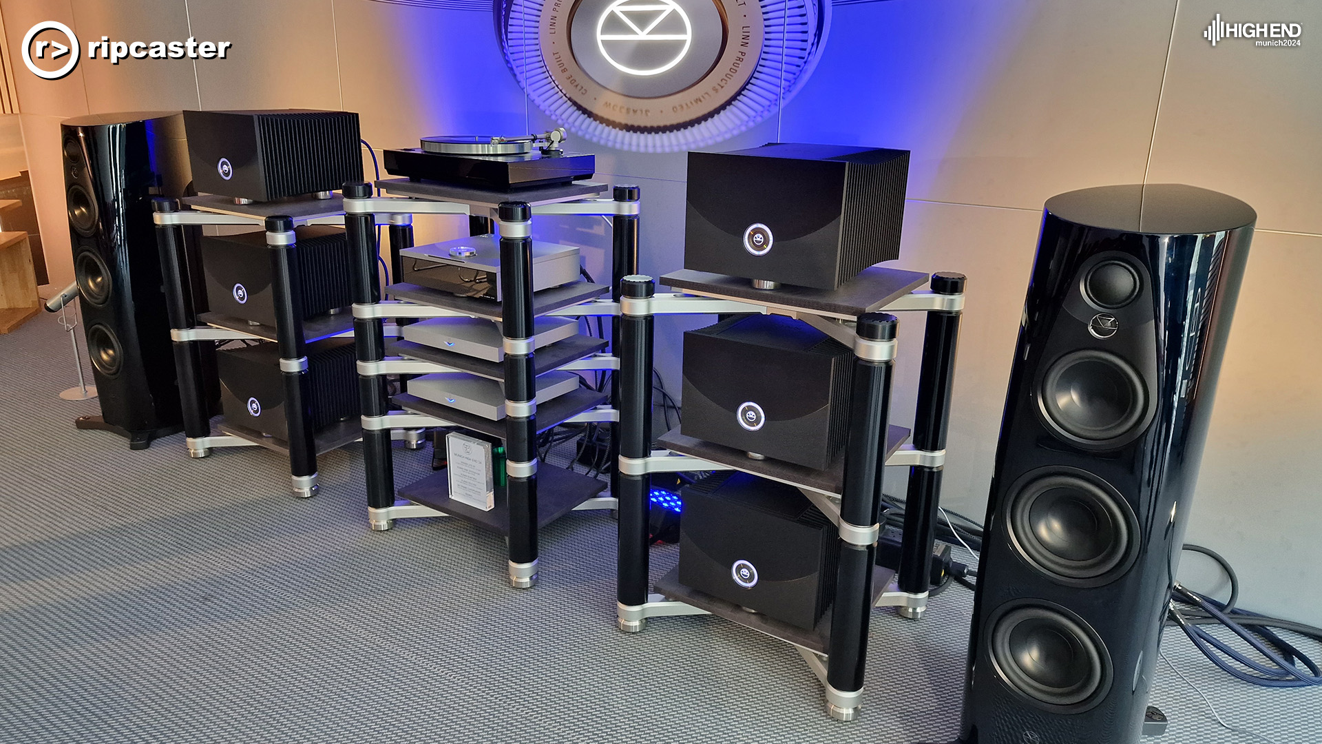 A lot of Linn equipment including a pair of floorstanding speakers, one either side of the image.
