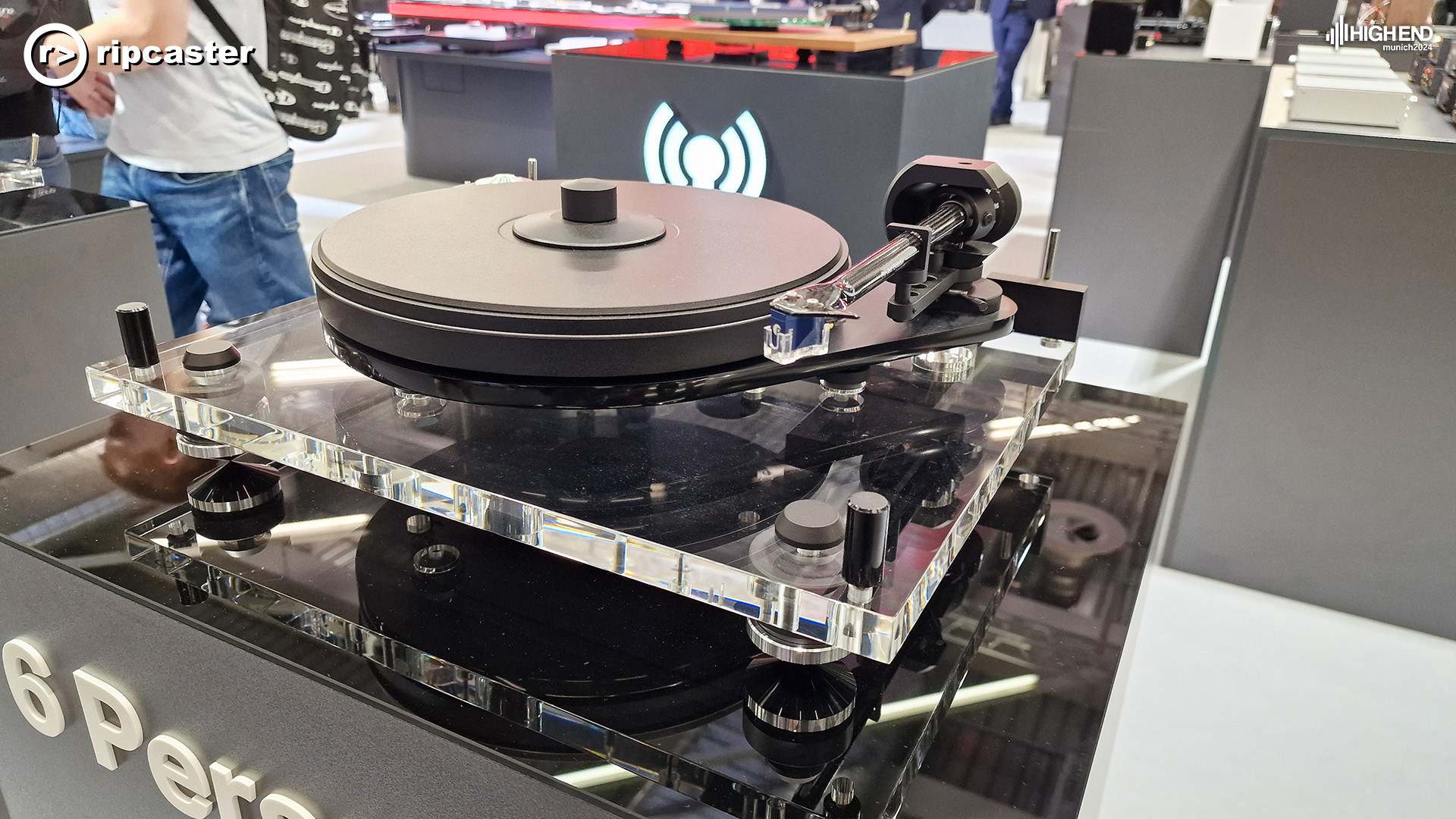 A Project turntable on a black stand 