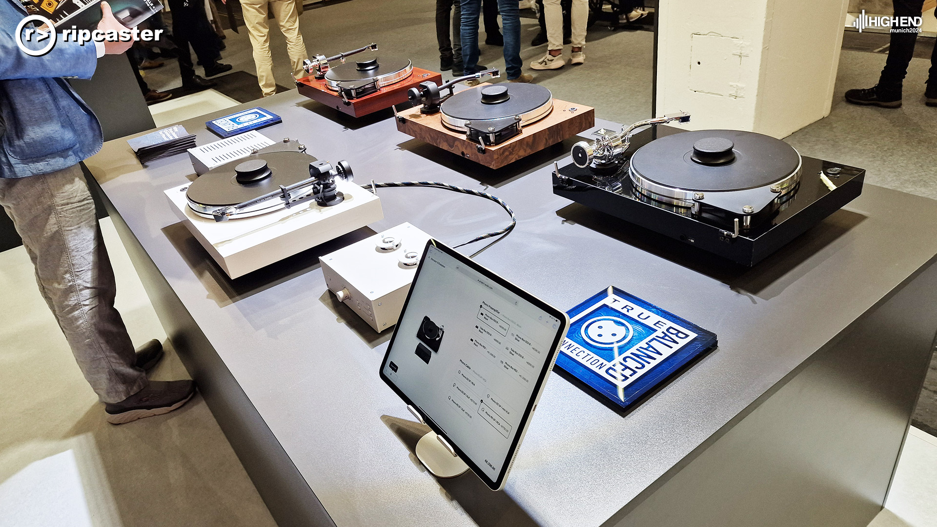 Project turntables on a black unit with an iPad in the foreground.