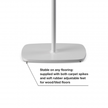 Flexson Floor Stand One/Play1 EU x2 close-up of the base with the words "stable on any flooring: supplied with both carpet spikes and soft rubber adjustable feet for wood/tiled floors".