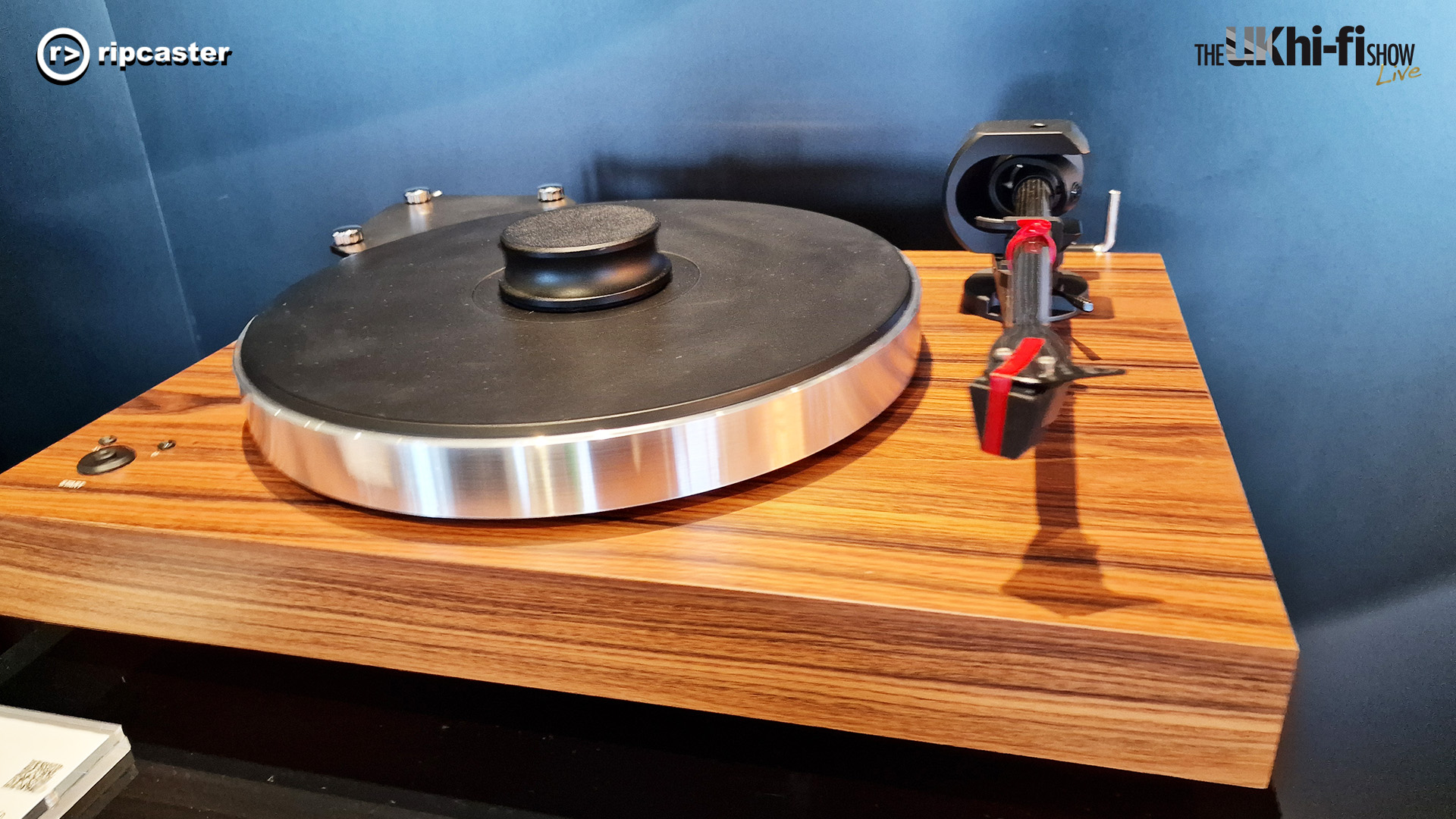 A record player with a wooden base