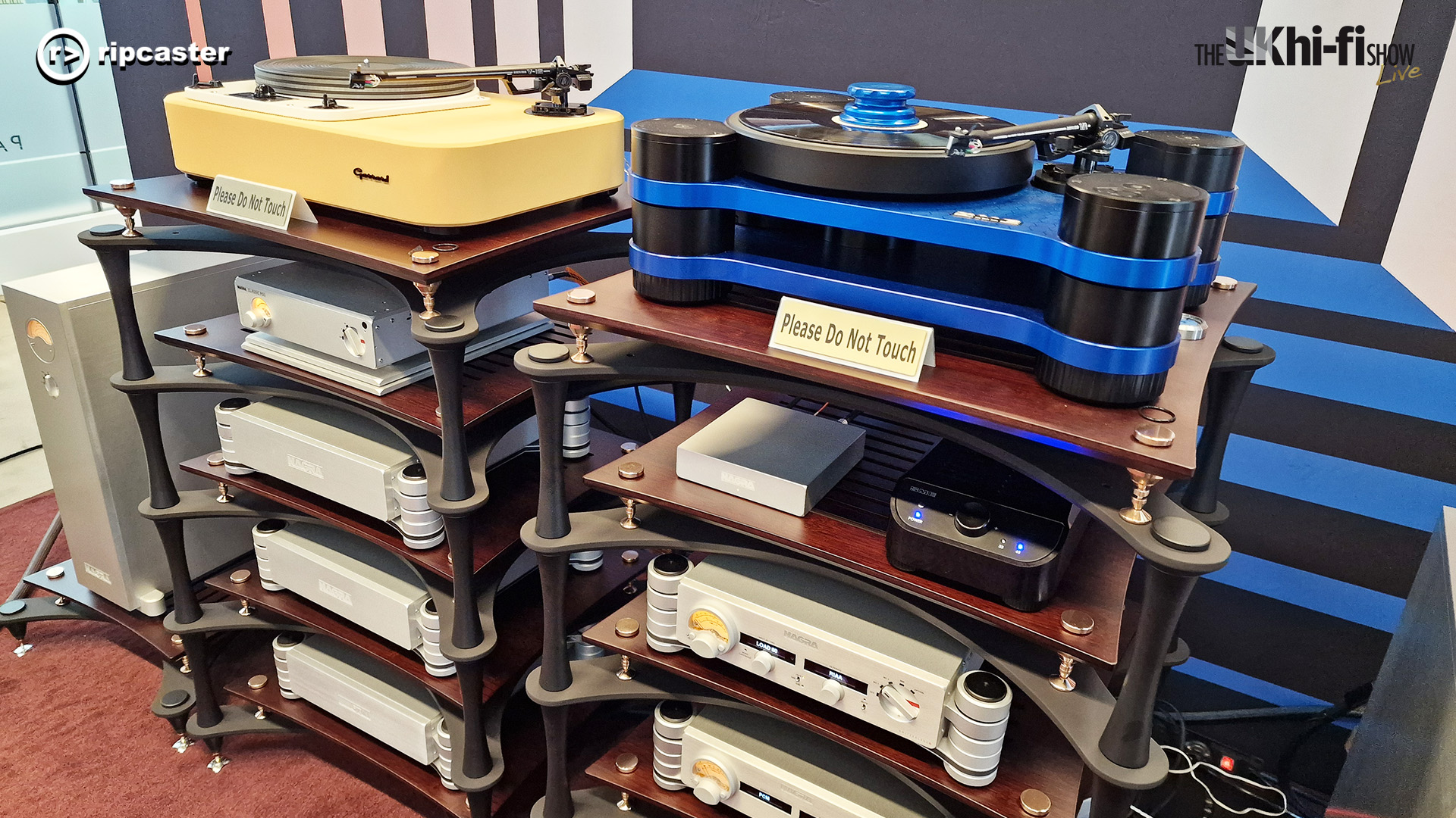 Two stacks of HiFi equipment side by side.  The left one has a yellow record player on top.  The right one has a blue record player