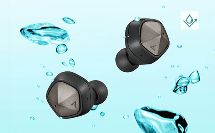 Astell & Kern UW100MKII earbuds on a background of water droplets