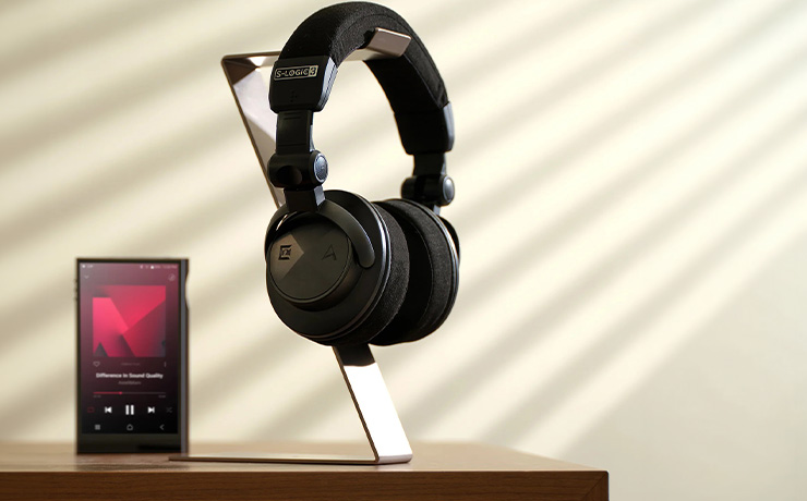 Astell & Kern Virtuoso Headphones on a stand with an A&K player beside it
