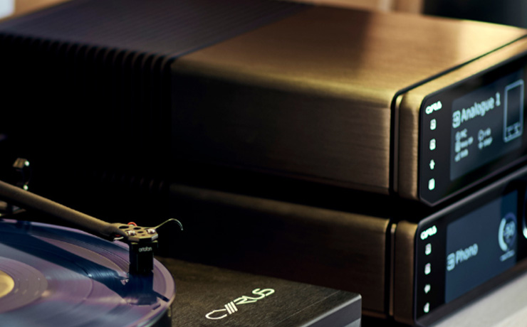 The Cyrus 40 PPA Phono Stage with another piece of Cyrus kit on top of it. Both are beside the Cyrus turntable