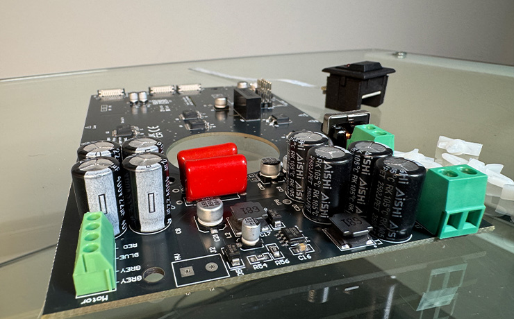 The Minos circuit board with the switch to the side of it