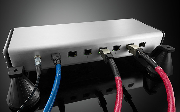The Nordost QNET7 Network Switch with various cables plugged into the back of it - which is the view facing us