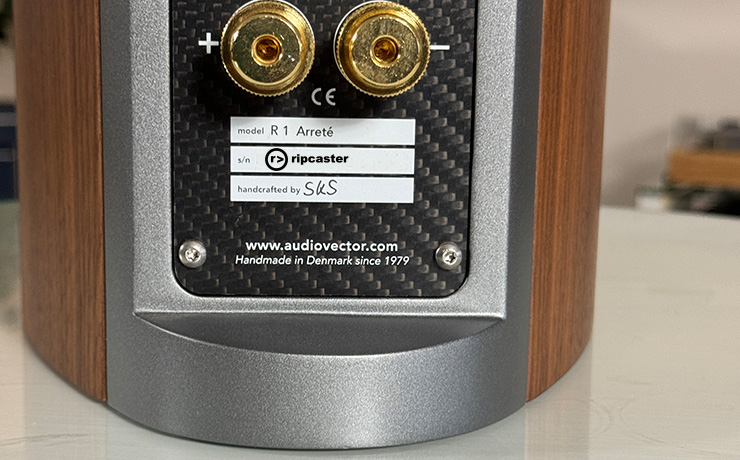 the back of the Audiovector R1 Arrete showing two connection points and the label showing the maker's signature, our ripcaster logo instead of the serial number and the model name.