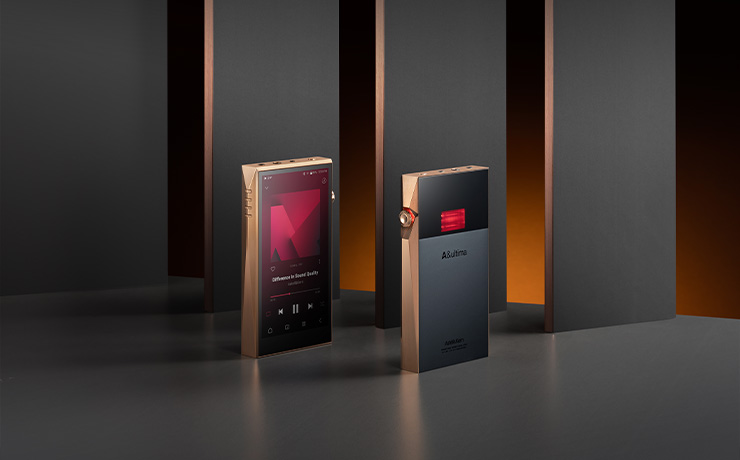 A pair of Astell & Kern A&ultima SP3000T Copper Edition Portable Music Players.  Both standing up, one front facing and one rear facing.