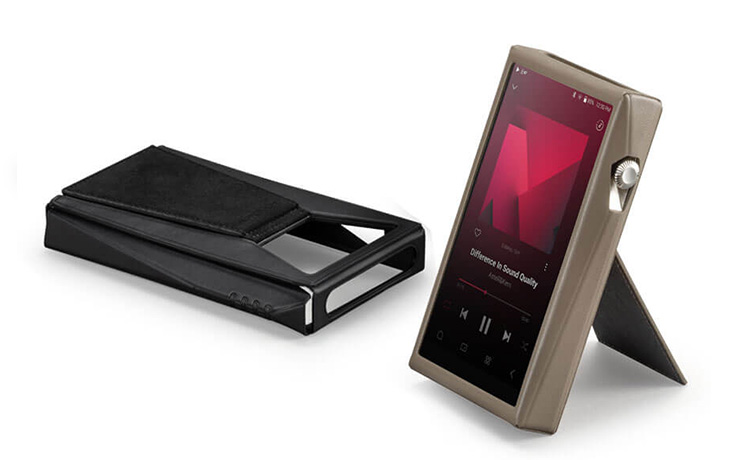 The Astell & Kern case for the SP3000T.  One black and one taupe.  The taupe one has a player inside and is standing up making use of the built in stand.