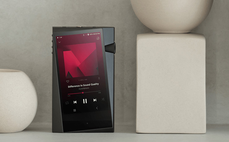 Astell & Kern A&norma SR35 Portable HiFi Player standing up beside a vase
