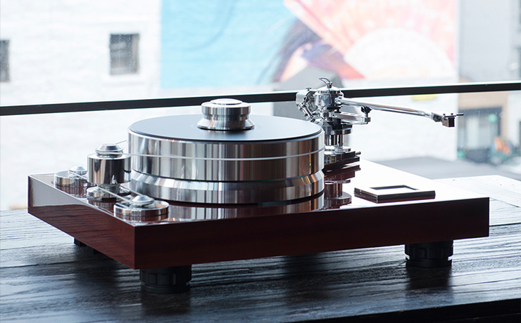 Project Signature 12 Turntable on a wooden unit