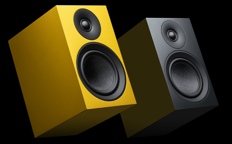 A pair of Project Speaker Box 5 E Carbon Loudspeakers - one yellow, one black