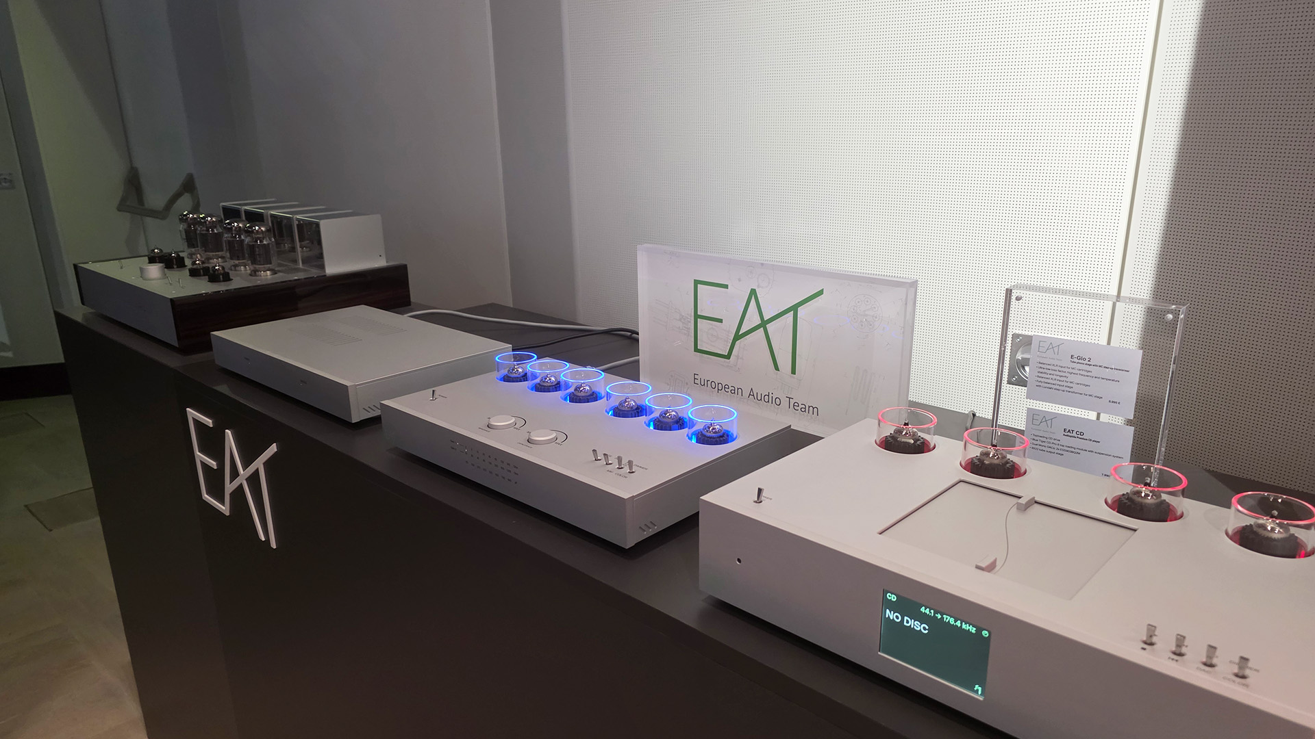 The EAT stand at the show with four different HiFi units on a black long unit
