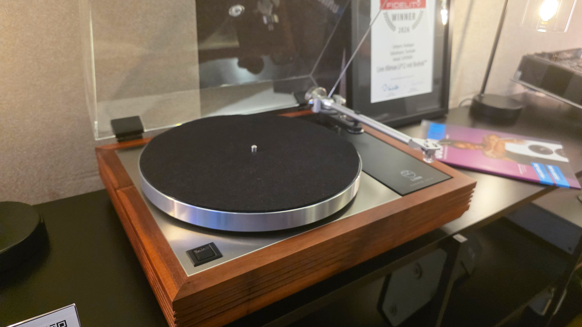 A Linn LP12 turntable on a black hifi unit