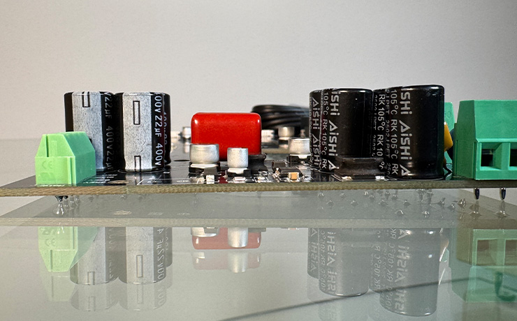 The Zeus circuit board reflected on a glass shelf