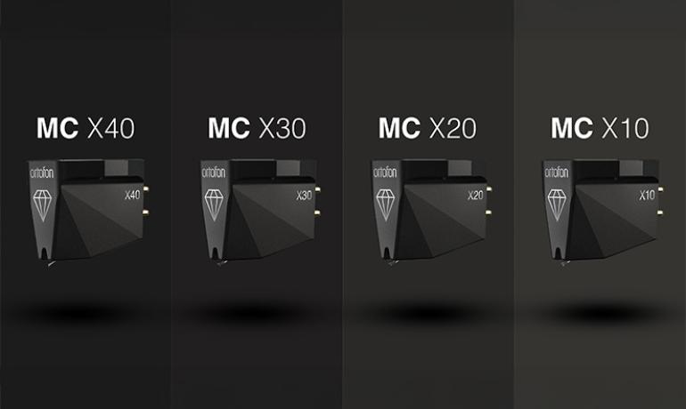 Ortofon MC X Series cartridges lined up on a black background