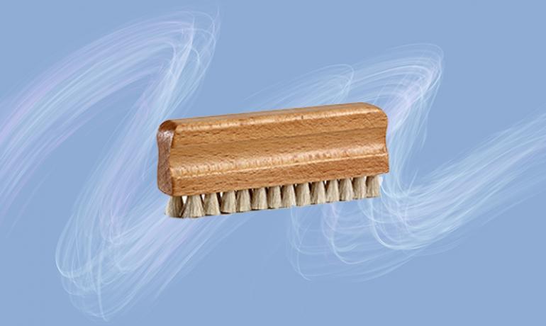Okki Nokki Goat's Hair Record Cleaning Brush on a blue and white background