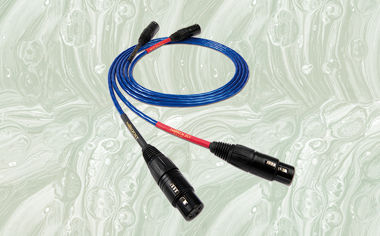 Nordost Leif Blue Heaven Analogue Interconnect Cable on a muted green splodgy background