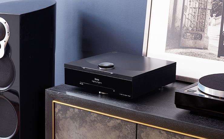 Linn Klimax DSM on a side unit beside an LP12 which is only partially visible and a partially visible Linn 350 speaker