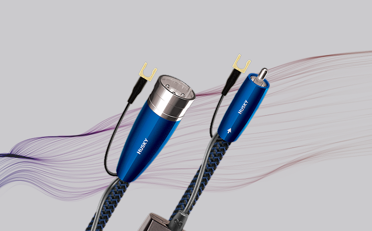 AudioQuest Husky Subwoofer Cable.  Background is grey with wavy colourful lines
