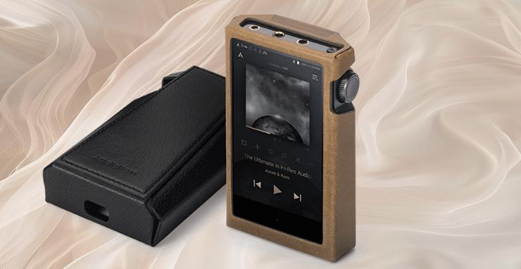 A pair of Astell & Kern Kann Max music players inside the case.  One laying flat face down and one standing facing the front