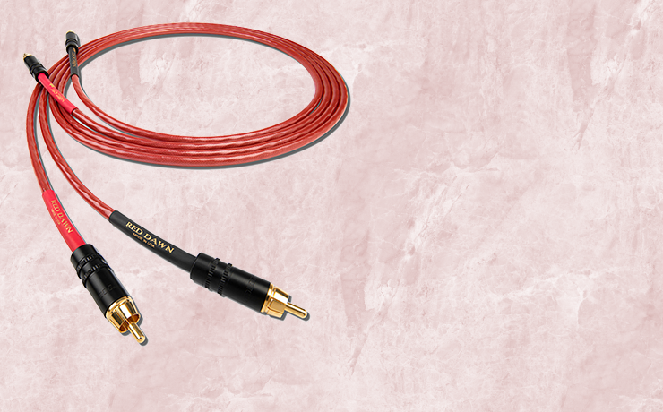 Nordost Red Dawn Analogue Interconnect.  Background is a salmon marble pattern.