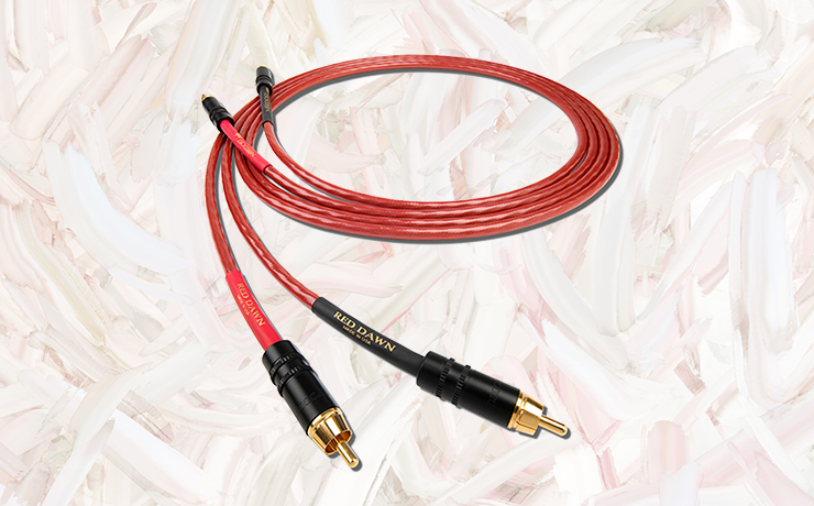 Nordost Leif Red Dawn Analogue Interconnect Cable on a pink and cream painted background.
