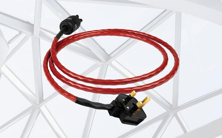 Nordost Red Dawn Power Cable.  Background: pexels-adrien-olichon-3137080 which is a criss-cross metal roof with glass.