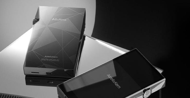 A pair of Astell & Kern A&Ultima SP3000 Portable Music Players on a table.  One face-up and one face-down