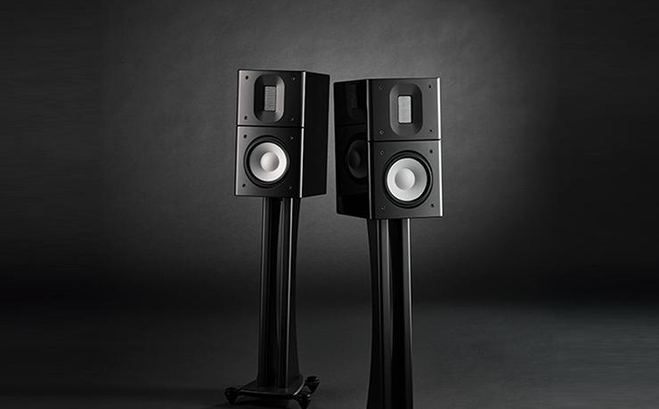 A pair of black Raidho Acoustics X1.6 Loudspeakers on a very dark background.