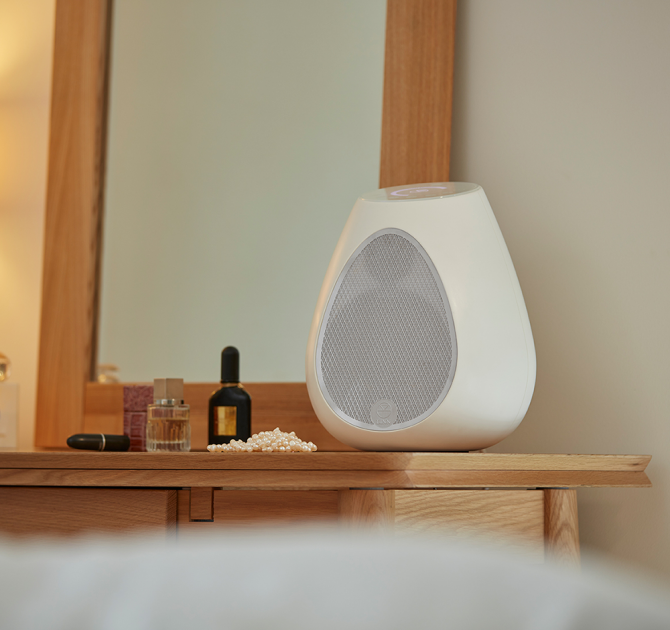 Linn Series 3 301 Loudspeaker on a bedroom dressing table with a mirror propped up behind it.