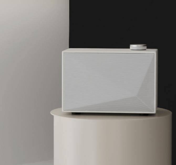 A white Astell & Kern ACRO BE100 Home Audio-Speaker