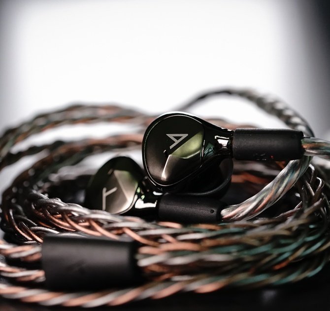 Astell & Kern AKT9iE Earphones Black with chord coiled.