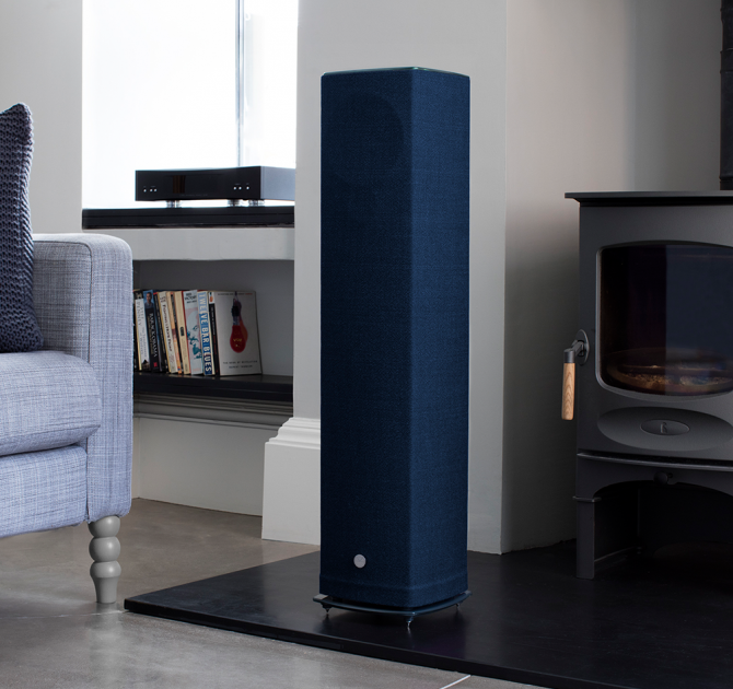 Linn Akurate DSM in a living room next to a blue, Series 5 speaker.