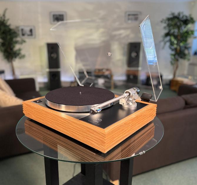Linn Majik MM LP12 Fluted turntable in oak in the ripcaster showroom with sofas and speakers in the background along with other HiFi equipment