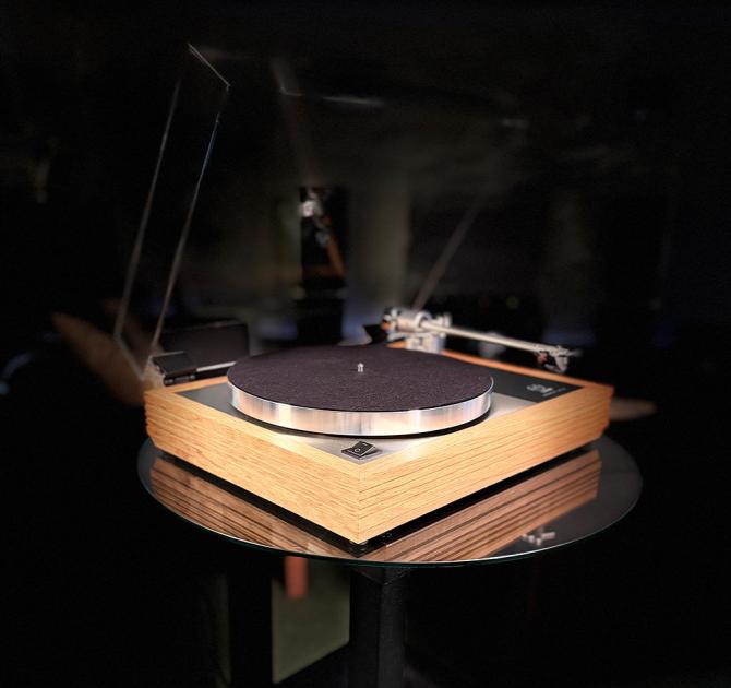 Linn Majik MM LP12 Fluted turntable in oak in the ripcaster showroom with sofas and speakers in the background along with other HiFi equipment