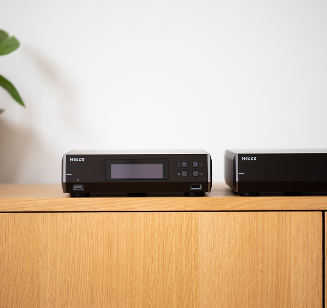 Melco N10/2 Digital Music Library in black.  One beside the other on a sideboard.