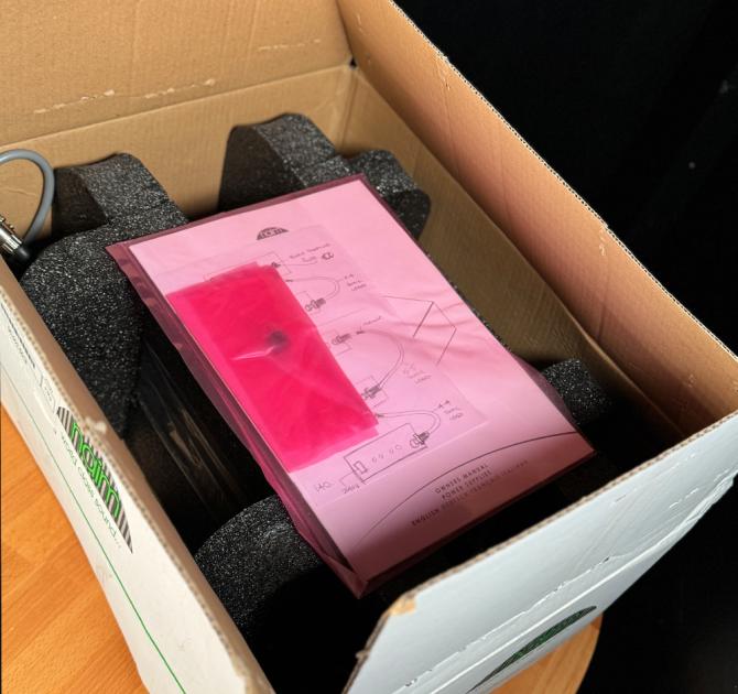 Naim HiCap Power Supply open box with instructions visible