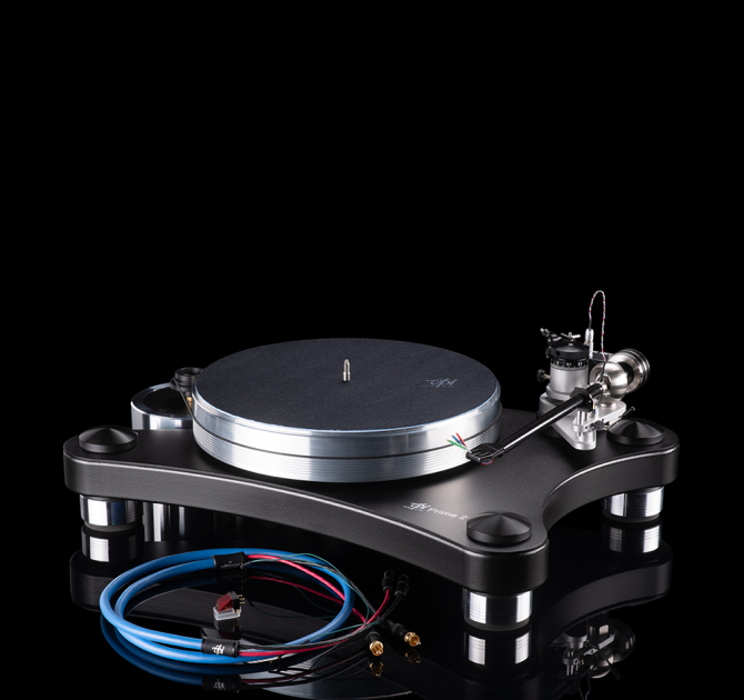 VPI Prime 21 Turntable in black with a cable coiled in front of it.  The background is black and the turntable is reflected on the surface it stands on.