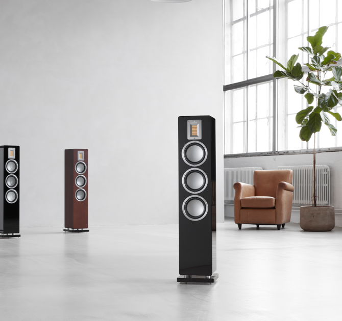 Audiovector QR5 - two black speakers and one dark walnut.