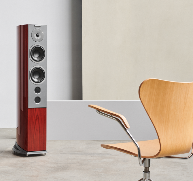 Audiovector R6 Signature in front of a wooden chair