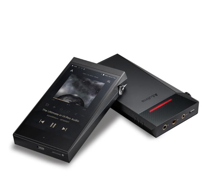 A pair of Astell & Kern A&Ultima SP2000T Portable Music Players laying down.  One partly on top of the other.