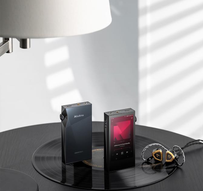 A pair of Astell & Kern A&ultima SP3000M Portable Music Players standing up ona  table