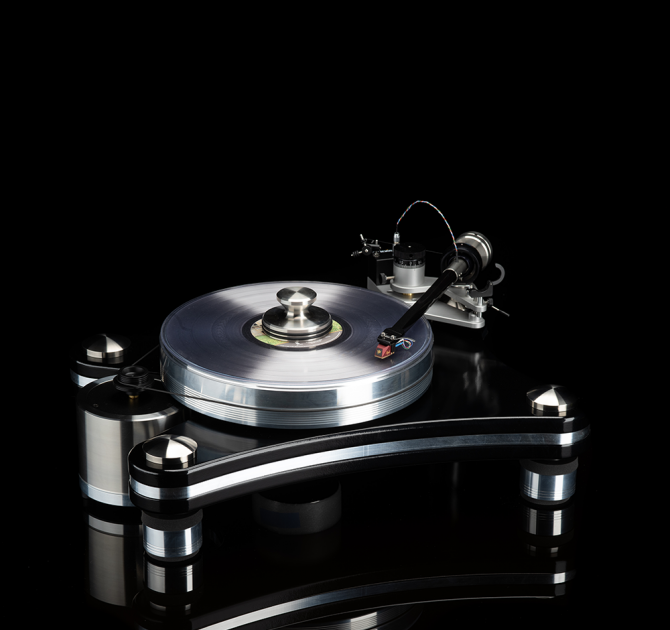 VPI Signature 21 Turntable on a black background.  Standing on a black reflective surface.