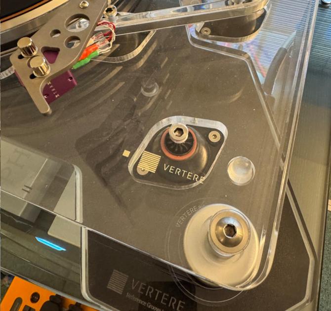 The Vertere ISO Shelf viewed in one corner from above with a Vertere acrylic turntable on top of it.